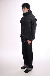 Person wearing the Ogp zip up outfit with a high collar on a white background