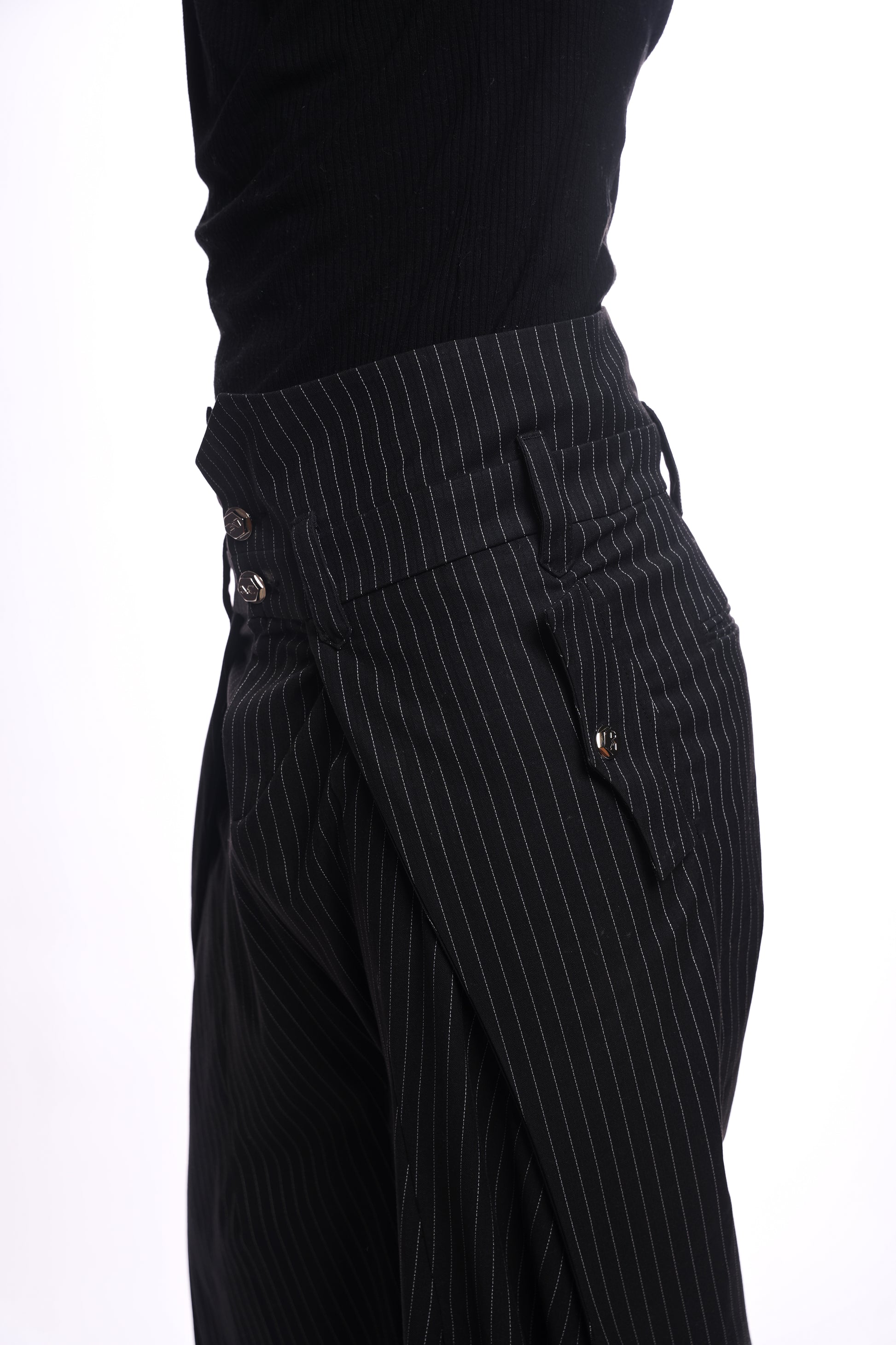 Black pinstripe pants with a white background, metal hardware