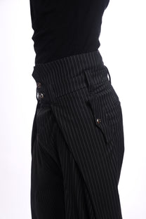 Black pinstripe pants with a white background, metal hardware
